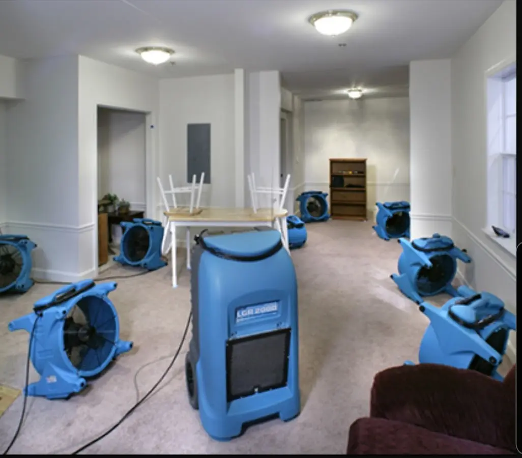 Air movers and dehumidifier setup for Water Damage Restoration in Lyons
